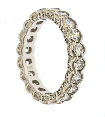 Semi bezel set round lab grown diamond alternative cubic zirconia eternity band in 14k white gold.