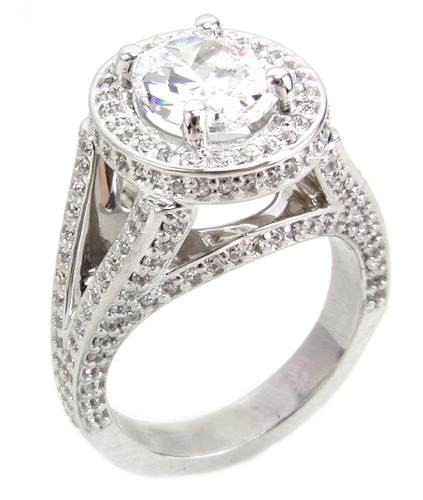 TomKat 1.5 carat oval laboratory grown diamond simulant cubic zirconia pave halo split shank solitaire engagement ring in 14k white gold.