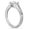 Claudine 1 carat round lab grown diamond look cubic zirconia pave engraved solitaire engagement ring in 18k white gold.