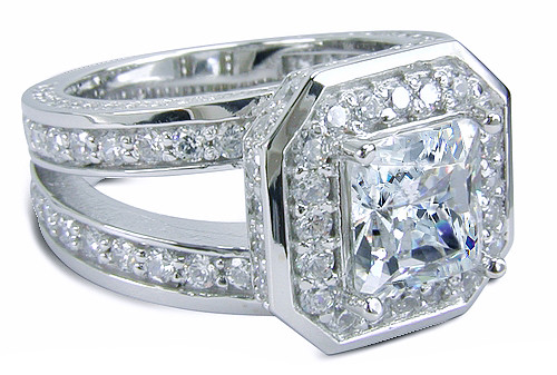 Ektiar 2.5 carat princess cut lab grown diamond alternative cubic zirconia pave set round halo split shank solitaire in 14k white gold.