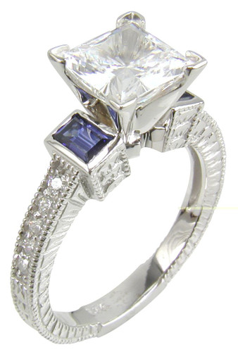 Trevora 1.5 carat princess cut lab grown diamond quality cubic zirconia emerald cut man made sapphire engagement ring in 14k white gold.