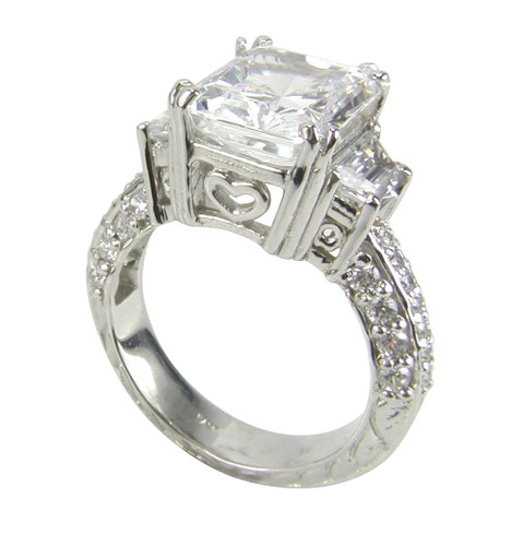 Laboratory grown diamond alternative cubic zirconia 5.5 carat emerald cut with trapezoid sides estate engraved engagement ring in 14k gold.