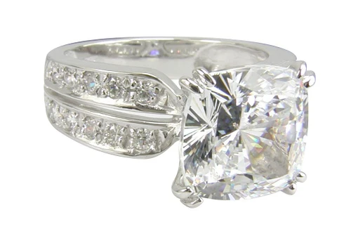 Spiga 5.5 carat cushion cut lab grown diamond alternative cubic zirconia split prong pave solitaire in platinum.