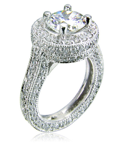 Manhattan 2 carat round lab grown diamond alternative cubic zirconia pave set round halo solitaire engagement ring in 14k white gold.