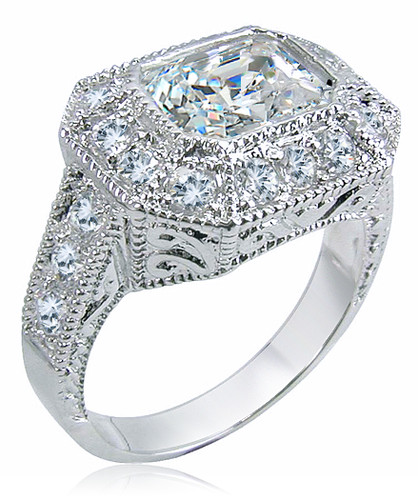 Emerald cut 2.5 carat horizontal set lab grown diamond simulant cubic zirconia pave estate antique ring in platinum.