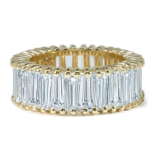 Dovetail tapered baguette prong set lab grown diamond look cubic zirconia eternity band in 14k yellow gold.