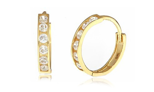 Medium mini lab created cubic zirconia round channel set hoop earrings in 14k yellow gold.