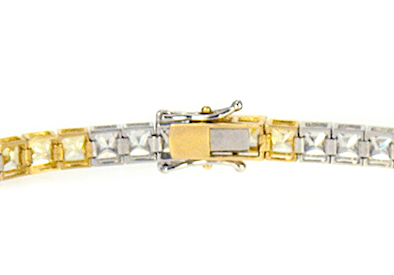 Alternating canary lab grown diamond simulant cubic zirconia tennis bracelet in two tone 14k gold.