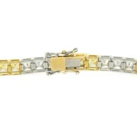 Alternating canary lab grown diamond alternative cubic zirconia tennis bracelet in two tone 14k gold.