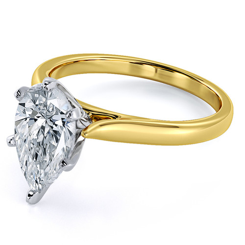 Pear shape lab grown diamond simulant cubic zirconia cathedral solitaire engagement ring in 18k yellow gold with platinum prongs.