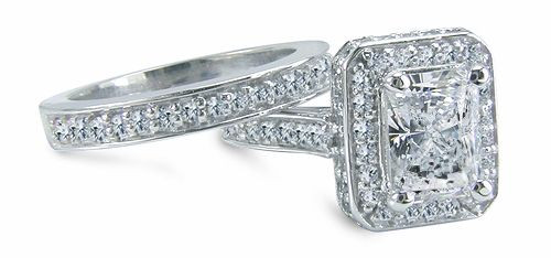 Elegant Emerald 4 carat lab grown diamond look cubic zirconia pave set halo cathedral wedding set in 14k white gold.
