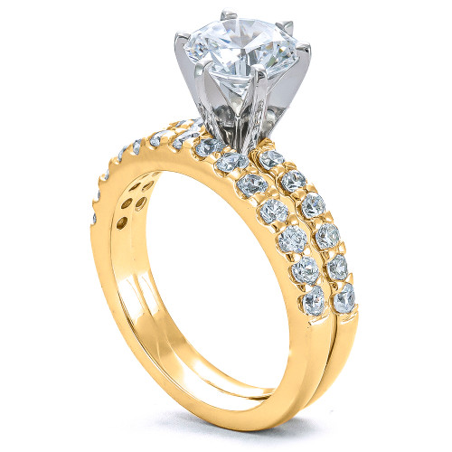 Round 1.5 carat solitaire and matching band wedding set with lab grown diamond look cubic zirconia in 14k yellow gold.