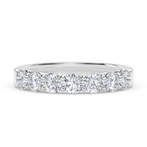 Prong set round seven stone lab grown diamond look cubic zirconia anniversary band in platinum.