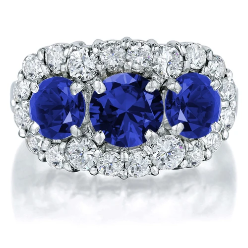 Trianna .75 carat round three stone lab grown diamond  simulant cubic zirconia and lab created blue sapphire halo ring in 14k white gold.