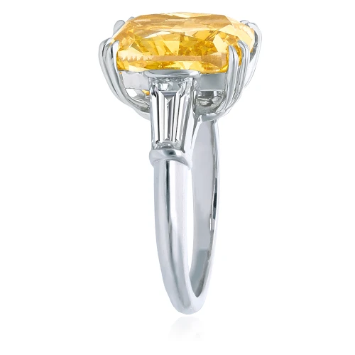 Elongated cushion cut laboratory grown diamond simulant cubic zirconia baguette solitaire engagement ring in 14K gold two-tone gold.