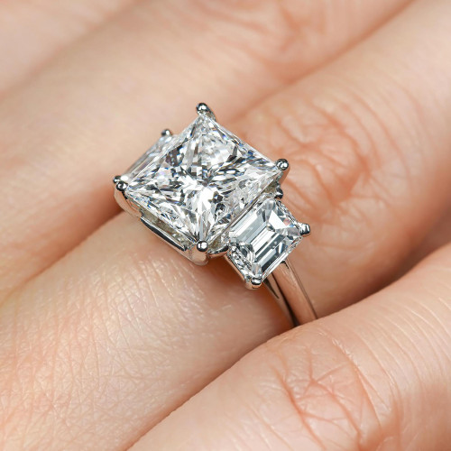 Emerald cut diamond sales ring with side stones