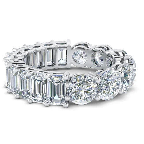 Alternity .50 carat round and emerald step cut laboratory grown diamond alternative cubic zirconia eternity band in 18k white gold.