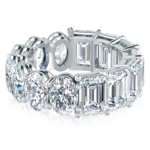 Alternity .75 carat oval and emerald step cut laboratory grown diamond simulant cubic zirconia eternity band in 14k white gold.