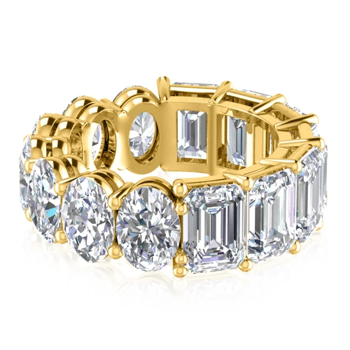 Alternity .75 carat oval and emerald step cut laboratory grown diamond alternative cubic zirconia eternity band in 14k yellow gold.