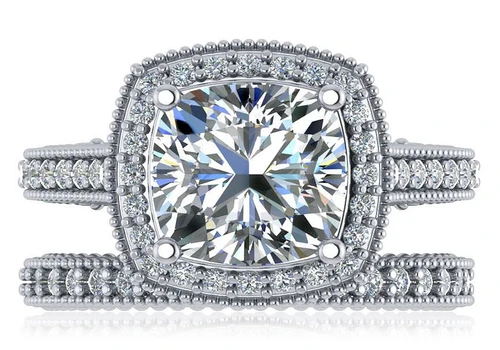 Cushion cut cathedral style pave lab grown diamond simulant cubic zirconia bridal set in platinum.