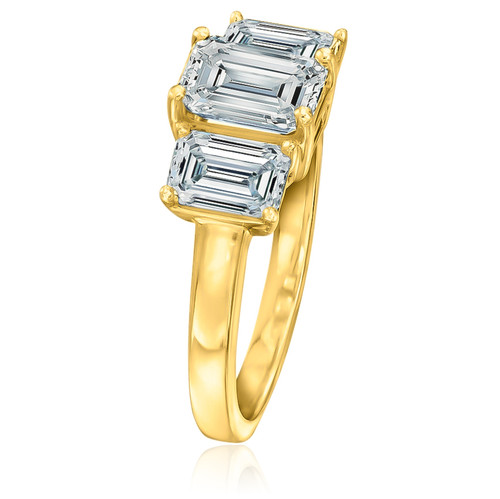 Three stone emerald step cut 1.5 carat center with 1 carat side stones lab grown diamond alternative cubic zirconia anniversary engagement ring in 14k yellow gold.