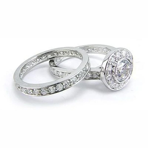 Round .75 carat bezel halo lab grown diamond simulant cubic zirconia solitaire bridal set in platinum.