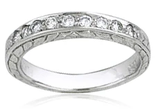 Engraved wedding band with lab grown diamond look cubic zirconia in 14k white gold.