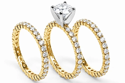 Round 1 Carat Three Ring Eternity Stacking Wedding Set with lab grown diamond look alternative cubic zirconia in 14k yellow gold.