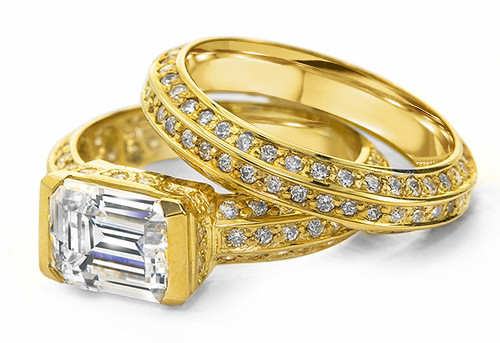 Emerald 1.5 Carat Radiant Cut Semi Bezel Set Pave Wedding Set with lab grown diamond simulant cubic zirconia in 14k yellow gold.