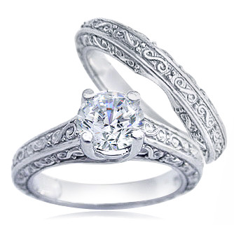 Engraved 1.5 Carat Round Trellis Luccia Bridal Set with lab grown diamond quality cubic zirconia in platinum.