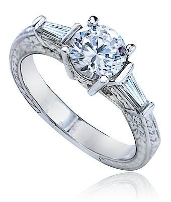 Hawthorne tapered baguette and 1 carat lab grown diamond look cubic zirconia round antique style engraved ring in platinum.