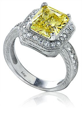Emerald radiant cut 4 carat lab grown diamond alternative cubic zirconia halo engraved ring in platinum.