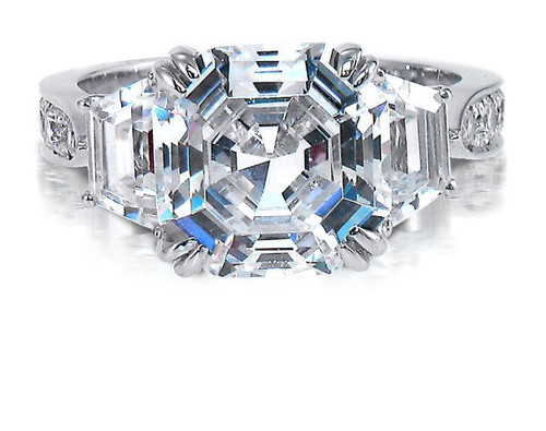 Muzeum 5.5 carat asscher cut lab created cubic zirconia trapezoid and round ring in platinum.