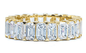 Sinclair .50 carat each emerald cut lab grown diamond simulant cubic zirconia eternity band in 14k yellow gold.