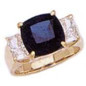 Tsoler 5.5 carat cushion cut with emerald cut lab grown diamond alternative cubic zirconia side stones in 18k yellow gold.