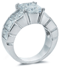 Emerald cut 4 carat lab grown diamond look cubic zirconia solitaire ring with graduated bezel set emerald cuts in 14k white gold.