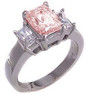 The Jen Ring Inspiration 4 Carat Pink Emerald Step Cut Cubic Zirconia Three Stone Solitaire Engagement Ring
