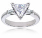 Trillion triangle lab grown diamond alternative cubic zirconia baguette solitaire engagement ring in 14k white gold.