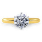Round six prong lab grown diamond simulant cubic zirconia tiffany style solitaire engagement ring in 14k yellow gold.