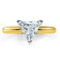 Trillion triangle lab grown diamond simulant cubic zirconia classic solitaire engagement ring in 14k yellow gold.