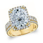 Emerald cut 9 carat halo lab grown diamond simulant cubic zirconia three stone engagement ring in 14K yellow gold.