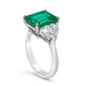 Emerald step cut lab grown diamond simulant cubic zirconia 7 carat with hearts three stone engagement ring in 18k white gold.