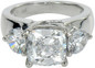 Dianna 4 carat cushion cut laboratory grown diamond look cubic zirconia three stone ring in 14k white gold.