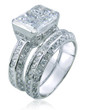 Emerald 1.5 Carat Radiant Cut Semi Bezel Set Pave Wedding Set with lab grown diamond look cubic zirconia in platinum.