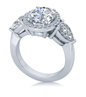 Oval 2.5 carat laboratory grown diamond quality cubic zirconia pave halo and pear sides engagement ring in 14k white gold.