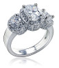 Vanessa 1.5 carat oval lab created cubic zirconia pave halo three stone ring in 14k white gold.