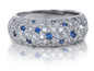 Pave set round man made sapphire and lab grown diamond look cubic zirconia anniversary band in platinum.