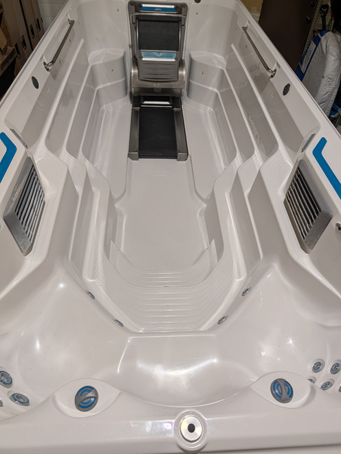 Make Waves with the E700 Endless Pool Swimspa 
The E700 Endless Pool gives you room to go big, with ample space for fitness, uninterrupted swimming, and full-body relaxation. Skip the $74,499 us MSRP and save over half off the price of a new model with Western Tub and Pool.
[Get a Quote Today]

Complete Specifications and Upgrades
Current

Hydrodrive™ Technology
1:08/100 yd (1:11/100 m) max pace with 116 pace settings

Construction

14 Gauge Galvanized Steel Frame with molded Acrylic Shell

Lighting

20 interior multicolor LED lights,
exterior LED illumination bar,
2 illuminated water features

Ample Space for Every Activity
Measuring 17’ L x 89" W x 58" H, the E700 provides plenty of room for all-level fitness routines, family fun, and deep relaxation.

Adjustable Hydrodrive Current
Train, recover, and improve with ease. The smooth, fully adjustable resistance current is perfect for an uninterrupted swim or a challenging water workout.

Ergonomic Spa Seats
After your workout, unwind in contoured seats equipped with premium hydrotherapy jets designed for total-body relaxation.

Upgraded Underwater Treadmill
This model includes the highly sought-after underwater treadmill upgrade. Experience our exclusive technology that makes low-impact workouts both fun and highly effective for your joints.

Upgraded Stereo System
Take your swim to the next level with the upgraded stereo system, delivering crisp, clear sound right to your pool.

The Western Tub and Pool Advantage
Save Over Half Off New
With the manufacturer MSRP sitting at $74,499 us as per manufacturer website , purchasing through Western Tub and Pool allows you to secure this premium model for less than half the price of a brand-new unit at 45,000 cad

Flexible Financing and Delivery
We make bringing your dream pool home simple. Take advantage of our convenient financing options and professional delivery services tailored to your schedule.

Premium Water Care
Keep your E700 in pristine condition with Western Tub and Pool water care solutions, ensuring your water remains crystal clear and ready for your next swim.

Frequently Asked Questions
How much does the E700 Endless Pool cost?
While the manufacturer's MSRP is $74,499 us , buying this fully-loaded E700 through Western Tub and Pool saves you over half the cost of a new mode for 45000 cad.

Do you offer delivery and installation support?
Yes, delivery is available directly to your home. We also offer comprehensive financing packages to make your purchase as seamless as possible.

Does this model come with the treadmill?
Absolutely. This specific E700 model features the upgraded underwater treadmill, offering a fantastic low-impact running or walking experience.

How do I maintain the water quality?
We guide you through the exclusive Western Tub and Pool water care routine, providing you with everything you need to maintain clean, balanced, and safe water year-round.

Transform Your Backyard Today
Ready to experience the ultimate in aquatic fitness and relaxation? Secure your upgraded E700 Endless Pool before it is gone.
[Contact Us for Pricing and Delivery]