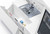 Janome Memory Craft 1000 Sewing & Embroidery Machine With the Bed Extension Opened Showing How To Store The Machine Accessories
