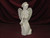 Ceramic Bisque Angel with a Horn sitting on a Ball pyop unpainted ready to paint diy